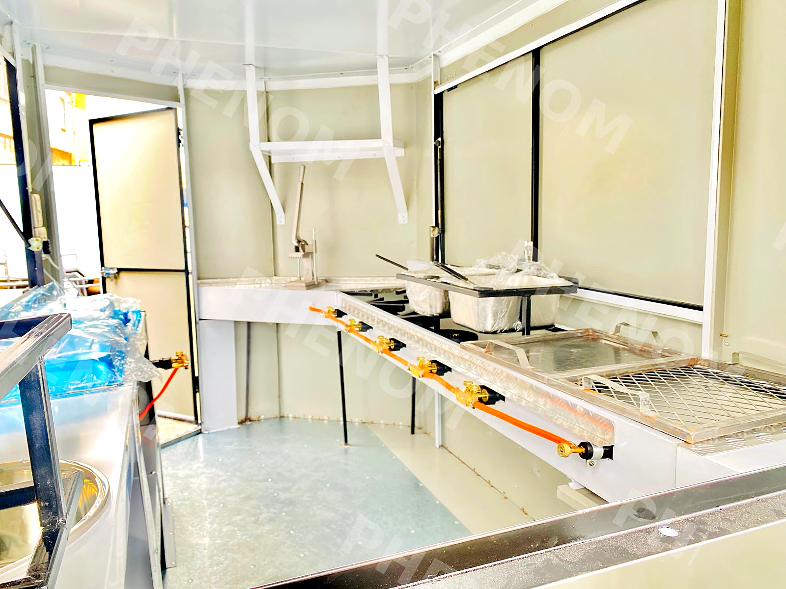 Inside a Phenom kitchen: gas rail, fryers and food warmers